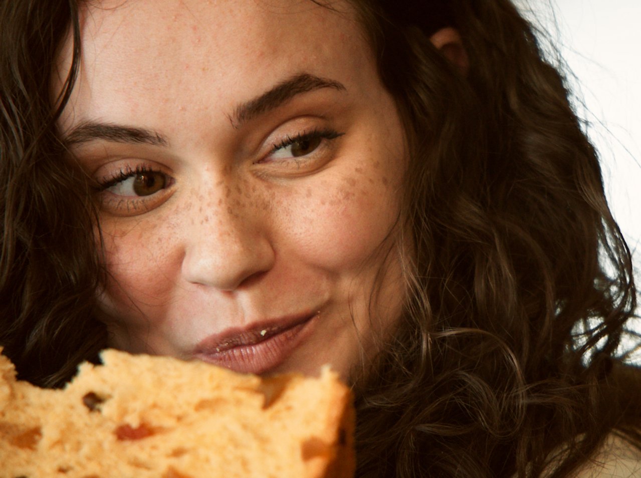 Woman eating panettone
